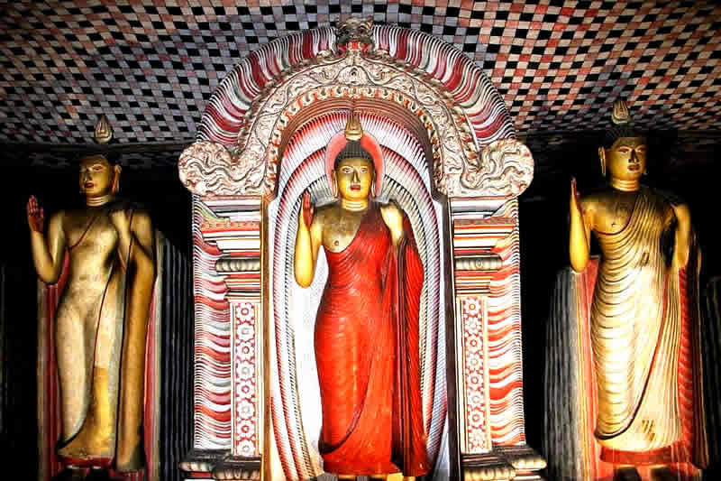 Standing Buddha at Dambulla cave temple,Visiting Sri Lanka Buddhist temples, Sri Lanka temple dress code, temple of the tooth dress code